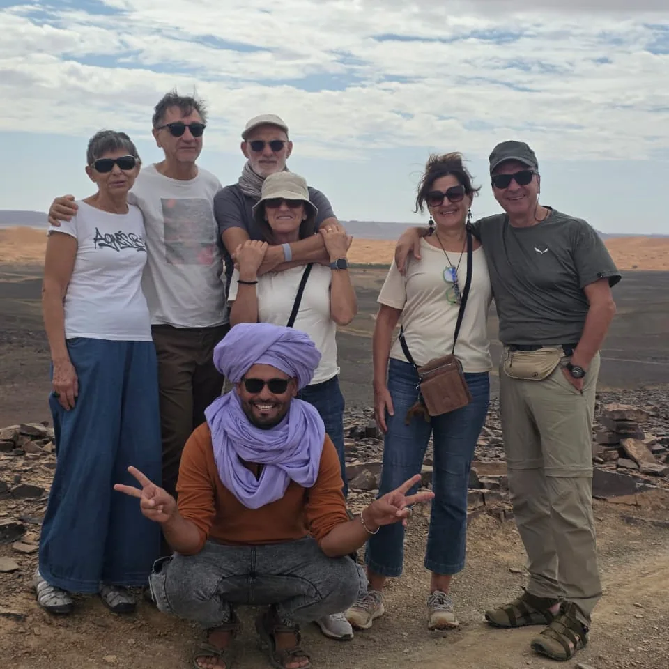 Mohamed with travelers in the Merzouga desert